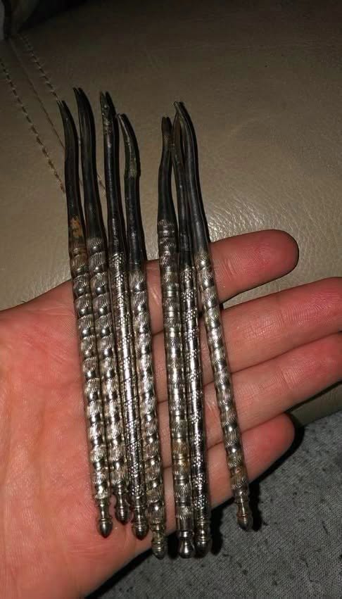 Vintage kitchen tools with ornate metal handles