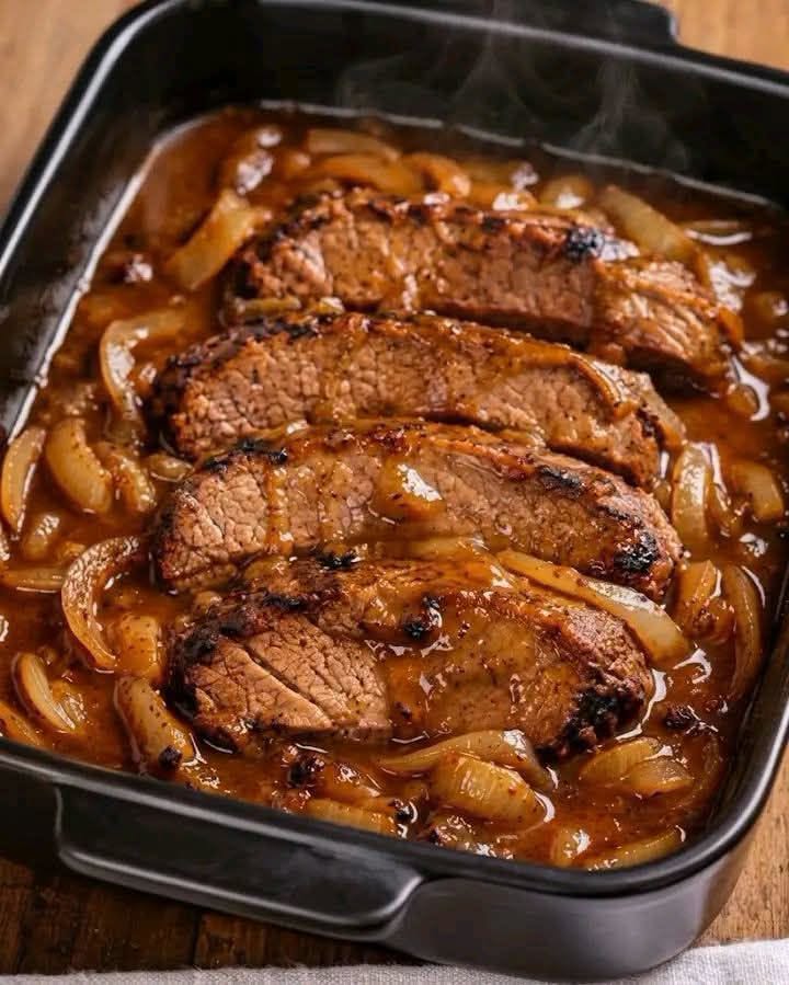 Slow Cooker Salisbury Steak with tender beef patties, sliced onions, and rich brown gravy.