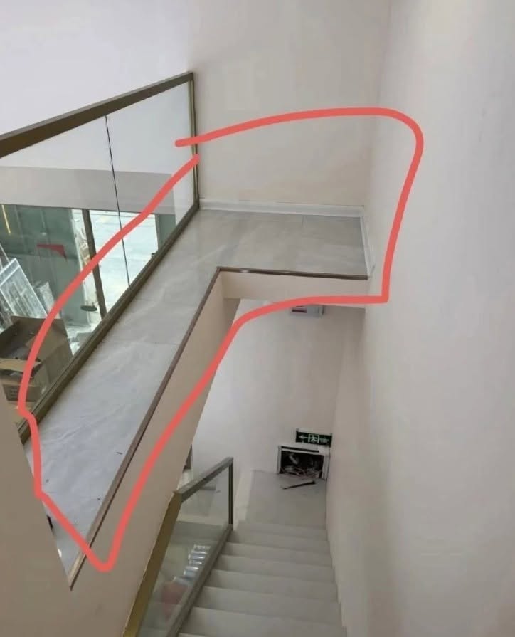 Unused space beside a staircase with potential for storage and home design